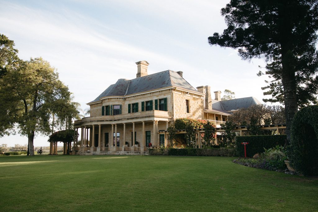 Historic sandstone homestead at Jimbour House in Queensland, a luxury heritage estate and popular destination wedding venue with manicured lawns and grand architecture.